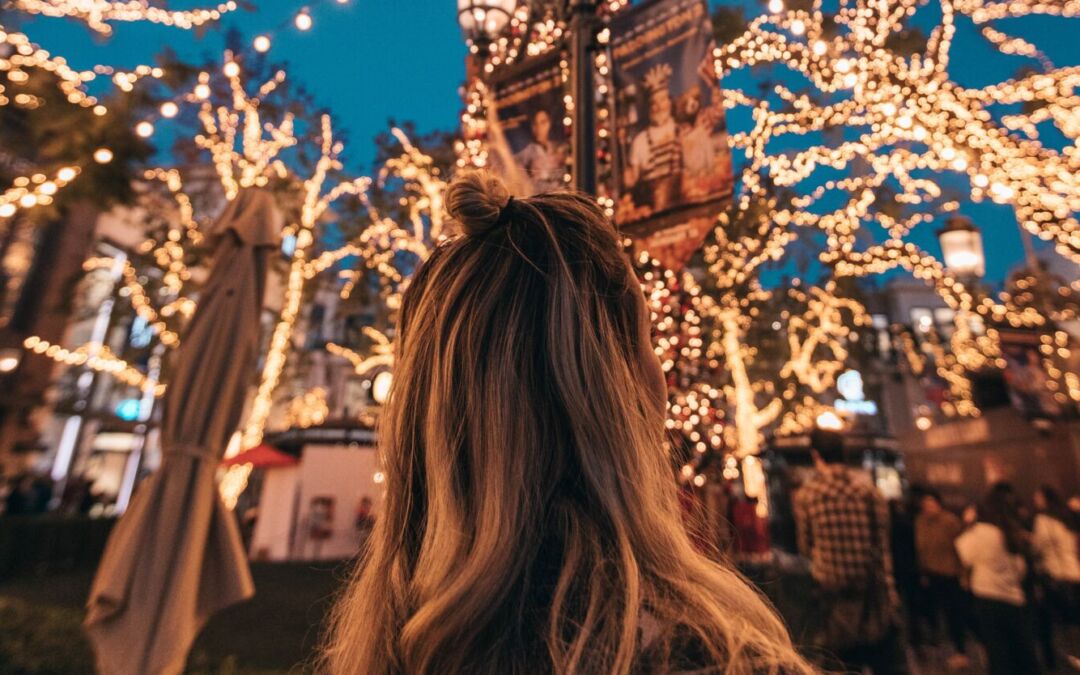 Girl admiring the fairy lights at the Llandudno Christmas Extravaganza